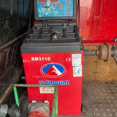 Red mount wheel balancer and 100 part worn tyres for sale