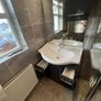 Bathroom Sink and Cabinet Image 3
