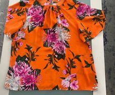Flowery orange blouse from warehouse