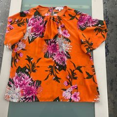 Flowery orange blouse from warehouse