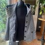 black and white short jacket with detachable faux fur scarf detail and cape sleeves. Image 5
