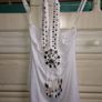 White top with pattern on it Image 3