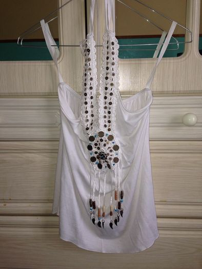 White top with pattern on it
