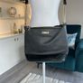 Carvela Black Handbag with gold chain. Image 2