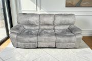 Grey 3 seater recliner sofa.
