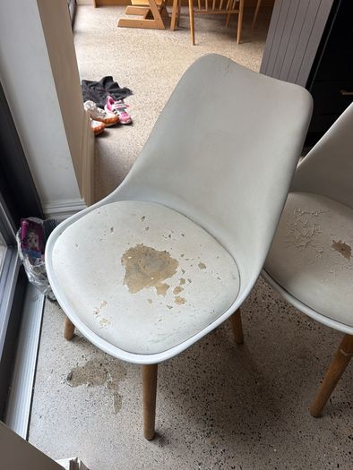 Two white bucket chairs