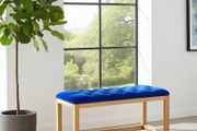 Wooden frame bench with velvet blue seat