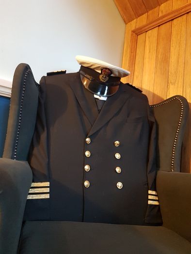 Queen Anne wingback chair / Quirky Ships Commander's uniform.