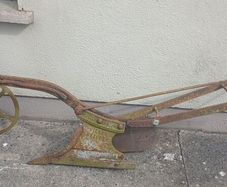 Two vintage ploughs