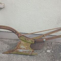 Two vintage ploughs