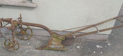 Two vintage ploughs