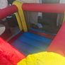 Happy Hop clown-themed bouncy castle with blower Image 9