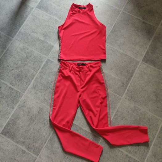 Red trousers and top set