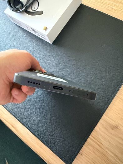 Xiaomi 14T phone with earbuds