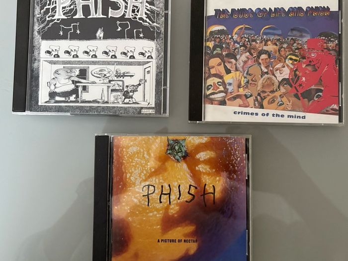 Three US albums by alternative band Phish. Includes A Picture of Nectar, double CD Junta and Crimes of the Mind. Price for all three but will sell individually. See below.