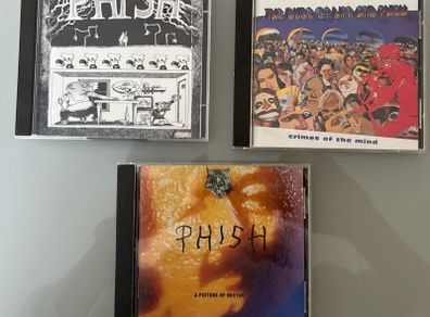 Three US albums by alternative band Phish. Includes A Picture of Nectar, double CD Junta and Crimes of the Mind. Price for all three but will sell individually. See below.