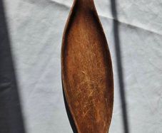 Hand-carved leaf-shaped bow