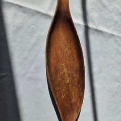 Hand-carved leaf-shaped bow