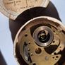 Lot of Antique Watch Parts in Containers Image 5