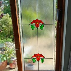 Large stained glass panel.135x54 cm.