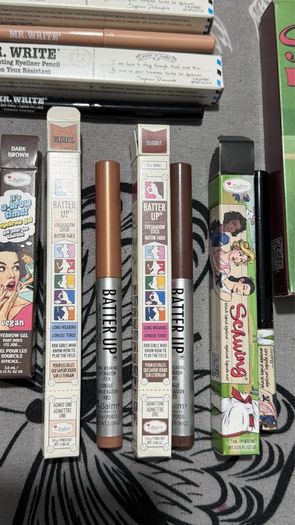 The balm tinted brow gel, clear brow gel, white, black eye pencils, liquid eyeliners