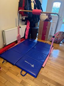Gymnastics bar and mats