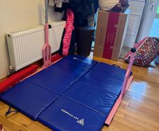 Gymnastics bar and mats