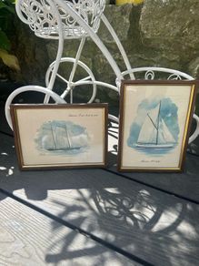 Two small framed prints of boats