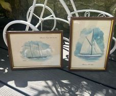 Two small framed prints of boats