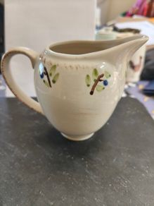 cream coloured milk jug