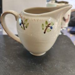 cream coloured milk jug