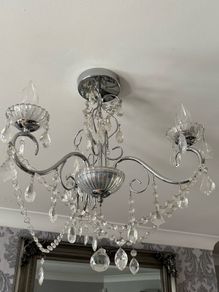chandelier and two wall uplighters
