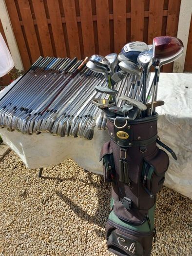 A selection of Golf clubs. Bags and golf balls.