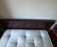 Queen size bed with wooden frame