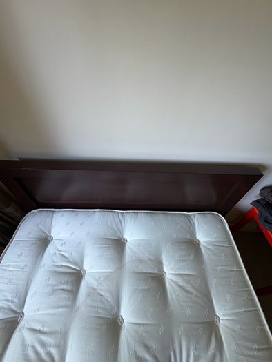 Queen size bed with wooden frame