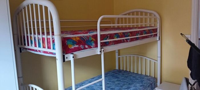 white metal bunk beds