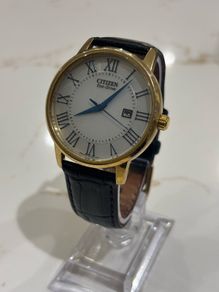 Citizen Men's Eco Drive White Dial Gold Tone Case Black Leather Strap