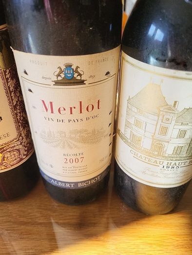 Full unopened wine bottles for display