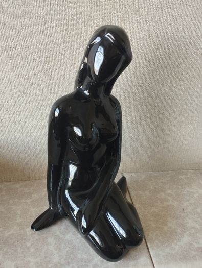 Vintage statue of a seated woman, nude figure, ceramic, glossy black.