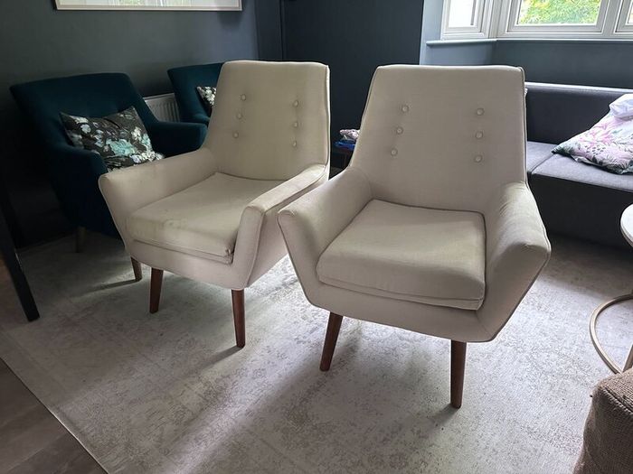 Two creme stylish armchairs
