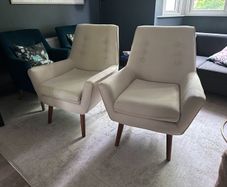 Two creme stylish armchairs