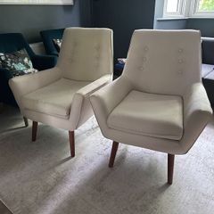Two creme stylish armchairs