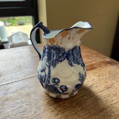 Blue and Willow porcelain jug with coat of arms