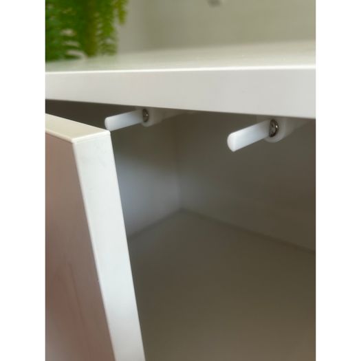 White IKEA cupboard on legs