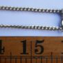 Flapper Gold Chain Necklace With Mixed Metal Wire Coil & Gold Tone Pendant Image 10