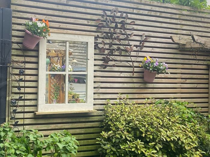 Garden mirror reflection window