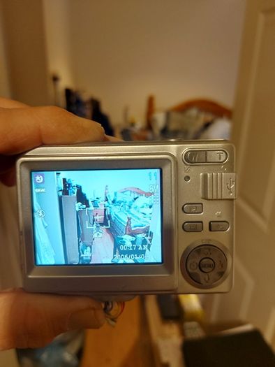 Z880 Digital Camera, Takes 2AA Batteries, working fine, has a modification that doesn't affect its performance