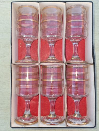 The set features six vintage vodka or liqueur glasses.