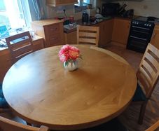 Large round oak table with 4 chairs