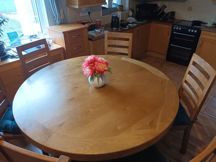 Large round oak table with 4 chairs